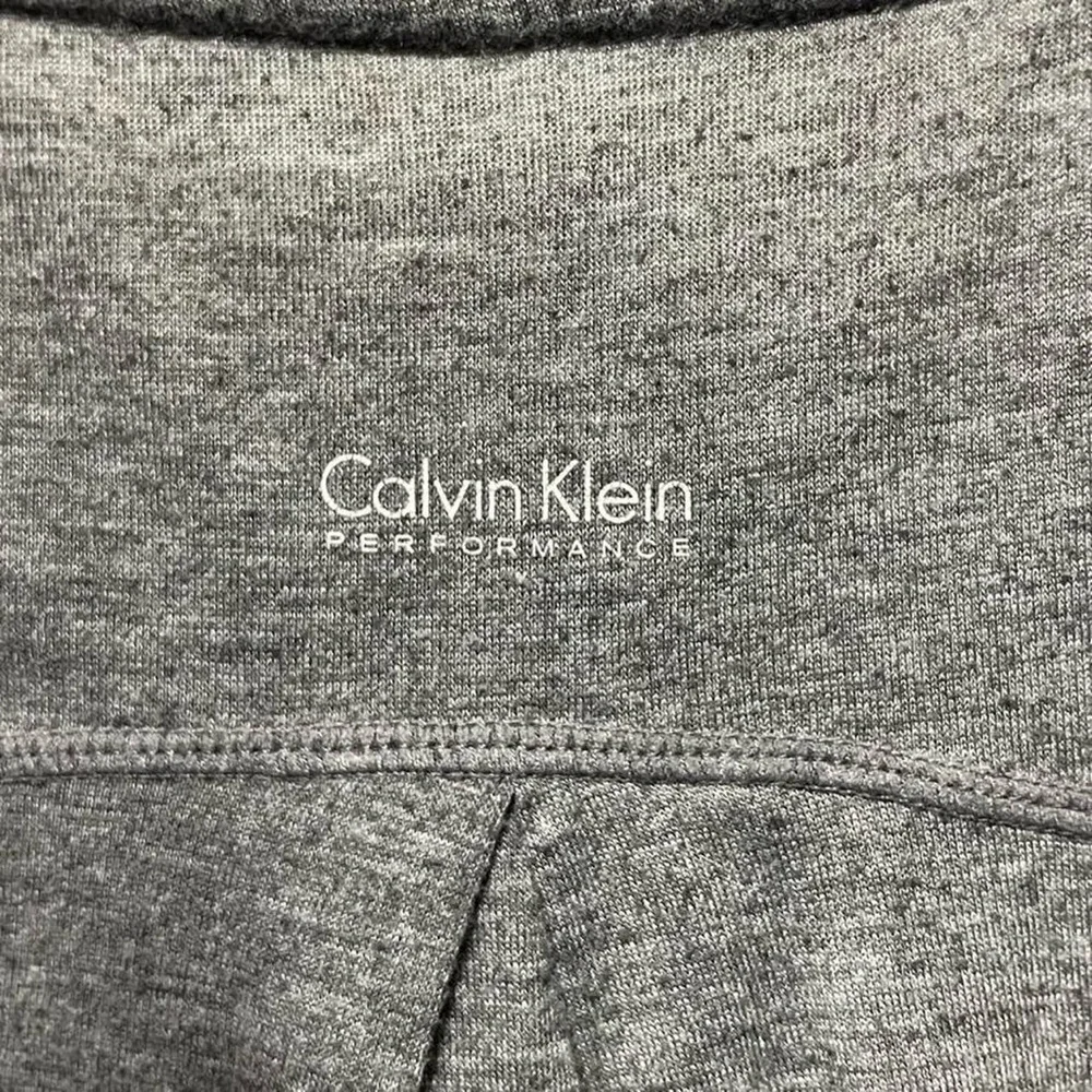 grey Calvin Klein performance Wick long sleeve crewneck activewear gym shirt top